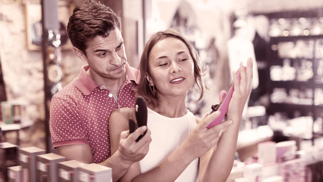 Man and woman shopping together for sex toys