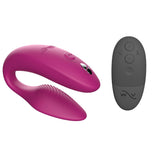 c-shaped hands-free wearable vibrator in pink and black external remote 