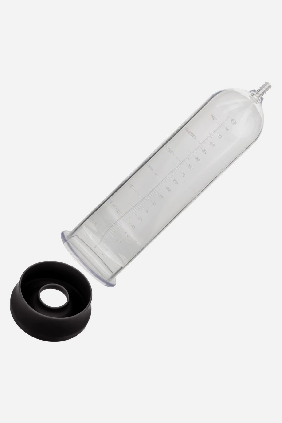 Clear At Your Peak penis pump cylinder with incremental measurement markings beside its black silicone entry sleeve, on a grey background