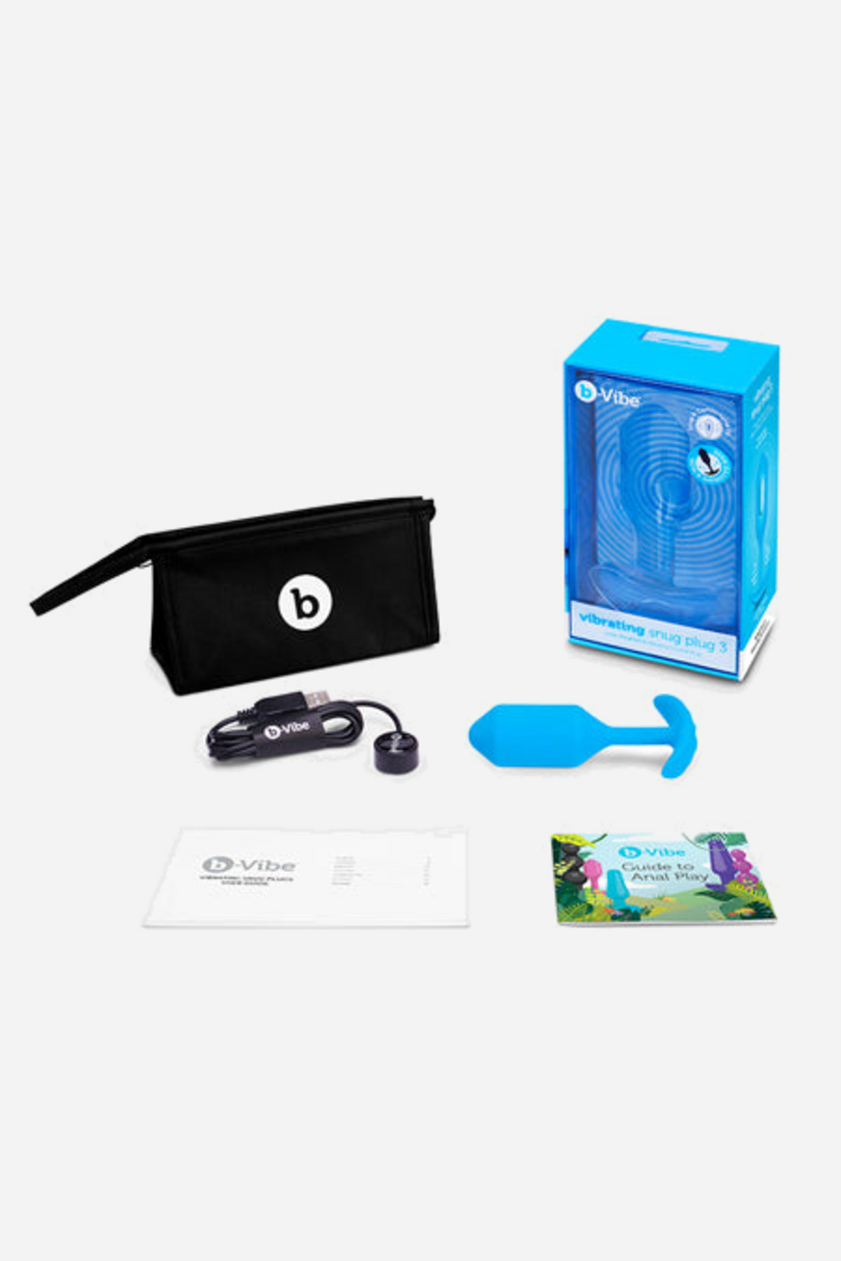 B-Vibe Vibrating Snug Plug 3 Large kit on grey: the blue plug, its retail box, a black zip travel bag, a magnetic USB charging cable and two guides.