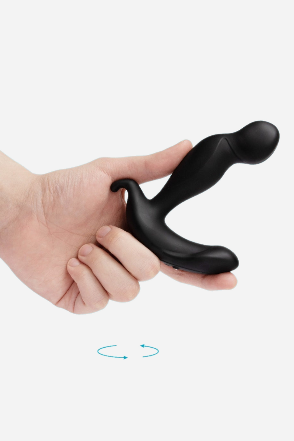Hand holding the B-Vibe 360 rotating and vibrating prostate plug, with arrows showing the circular rotating motion of its tip, on grey
