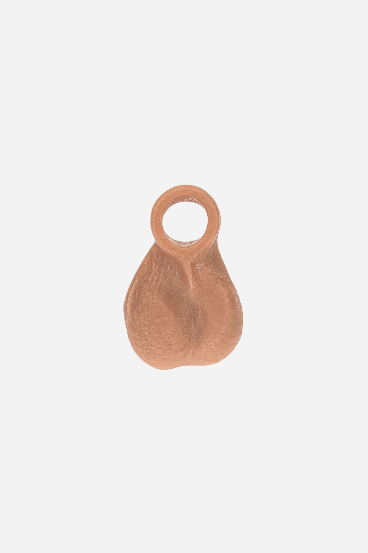 Ball Bump attachment cock ring in Caramel, front view of the realistic textured balls with the stretchy ring on top, on light grey