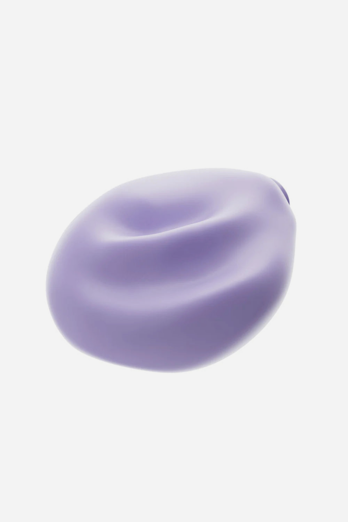 Angled view of the lavender Be Urself Vibrating Pulse Pad showing its soft, squishy rounded silicone shape and gently ridged grinding surface