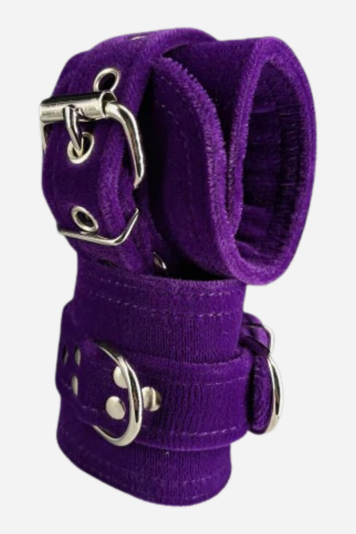 Pair of wide purple velvet restraint cuffs stacked together, with purple stitched edges, silver roller buckles, grommets and a silver D-ring on each cuff.