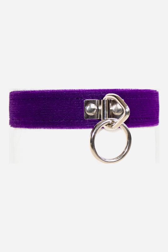 Front view of the royal purple Caress velvet collar fastened, showing the nickel-plated heart-shaped D-ring and hanging O-ring at the centre