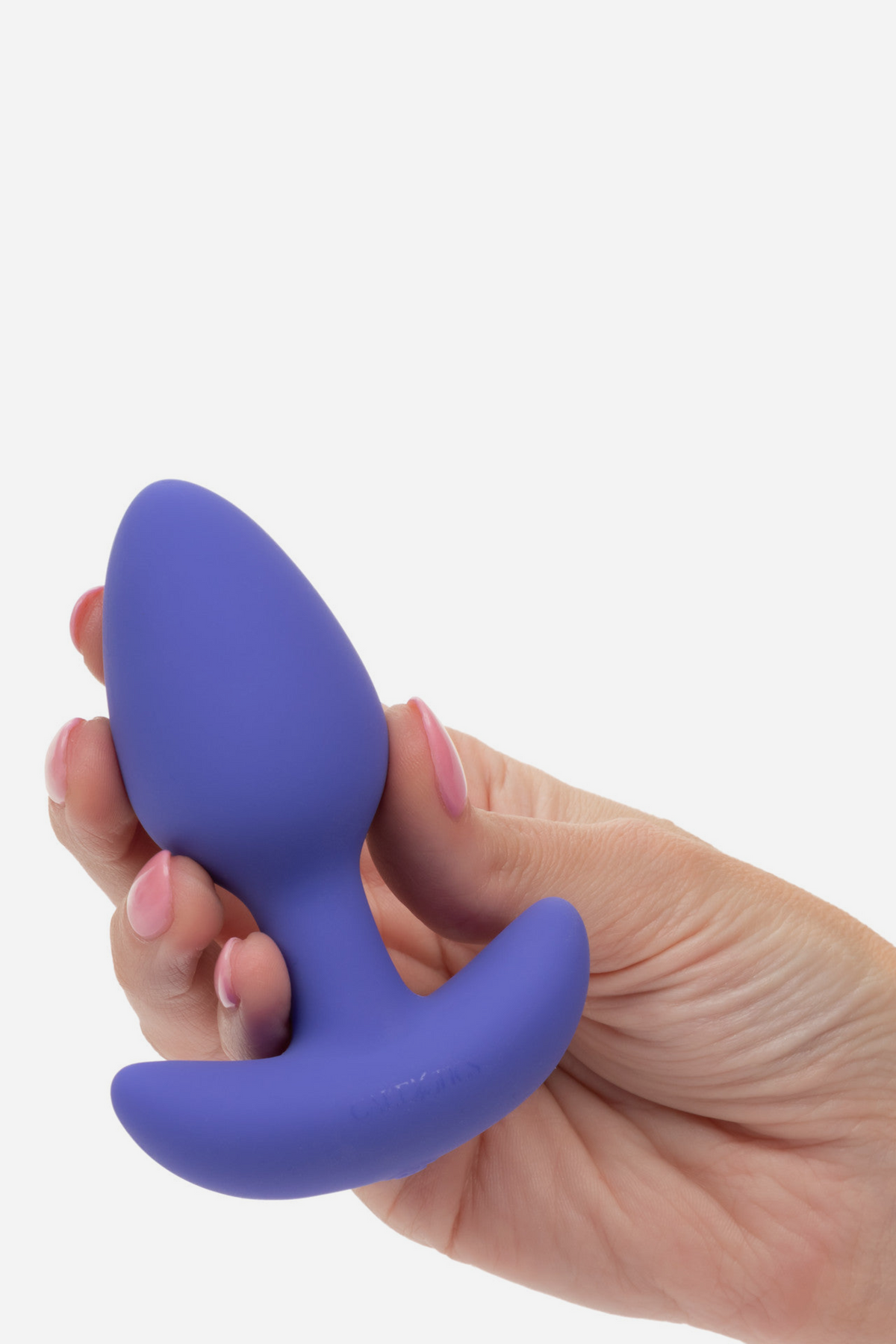 Connect Us app controlled plug in periwinkle purple held in a hand, showing its compact size and tapered tip, on a light grey background