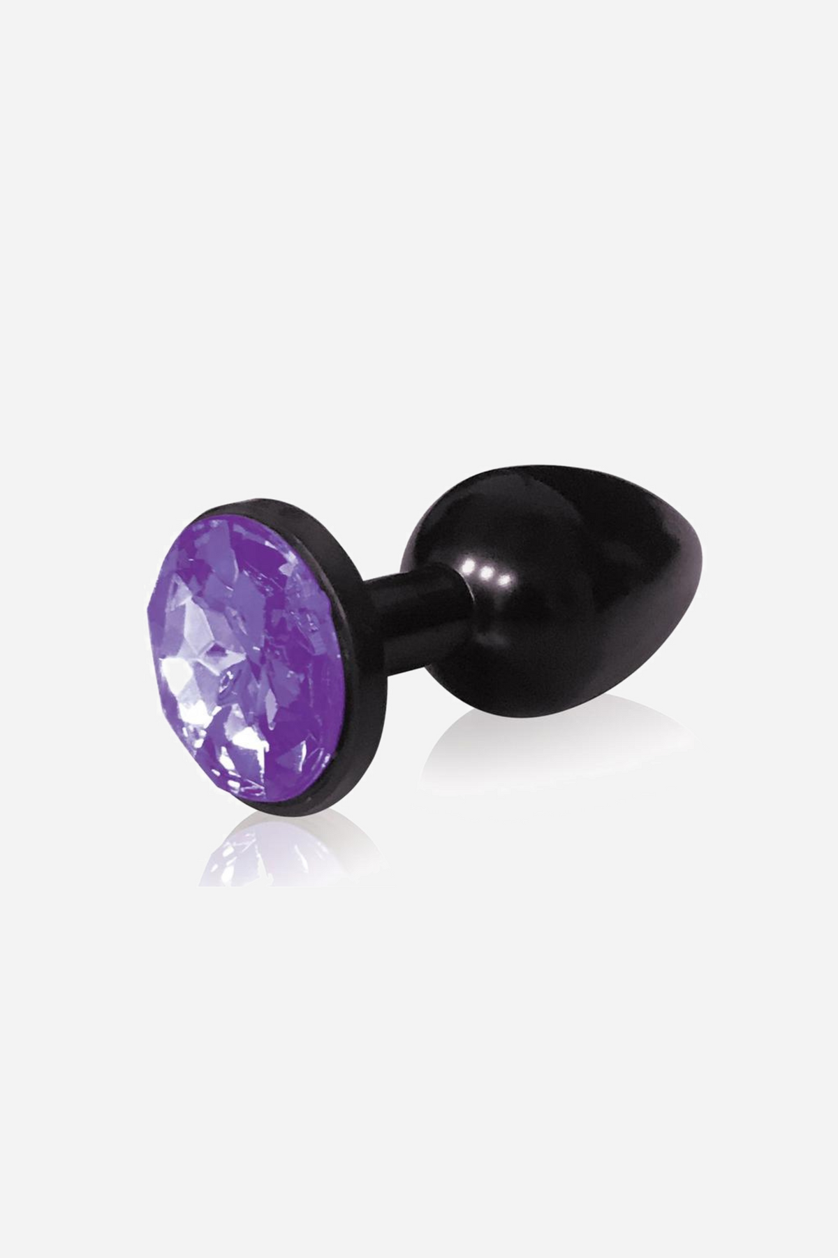 The same small black metal plug with a violet faceted gem set in its flared base, lying on its side against a plain grey backdrop.