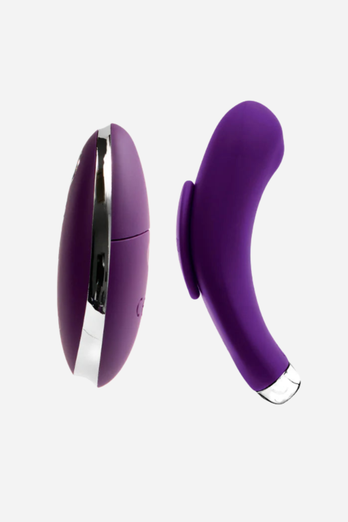 The purple Flexi Niki vibe standing beside its oval remote on grey, showing the curve of the vibe against the flat face of the remote.