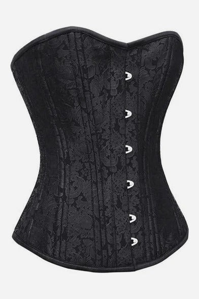 Angled view of the black brocade Flourish overbust corset showing its curved sweetheart bust, nipped hourglass waist and silver busk clasps