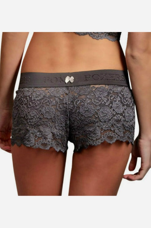 Close-up back view of charcoal gray Foxers lace boxers with scalloped lace leg edges, a wide gray waistband and a small bow at the back