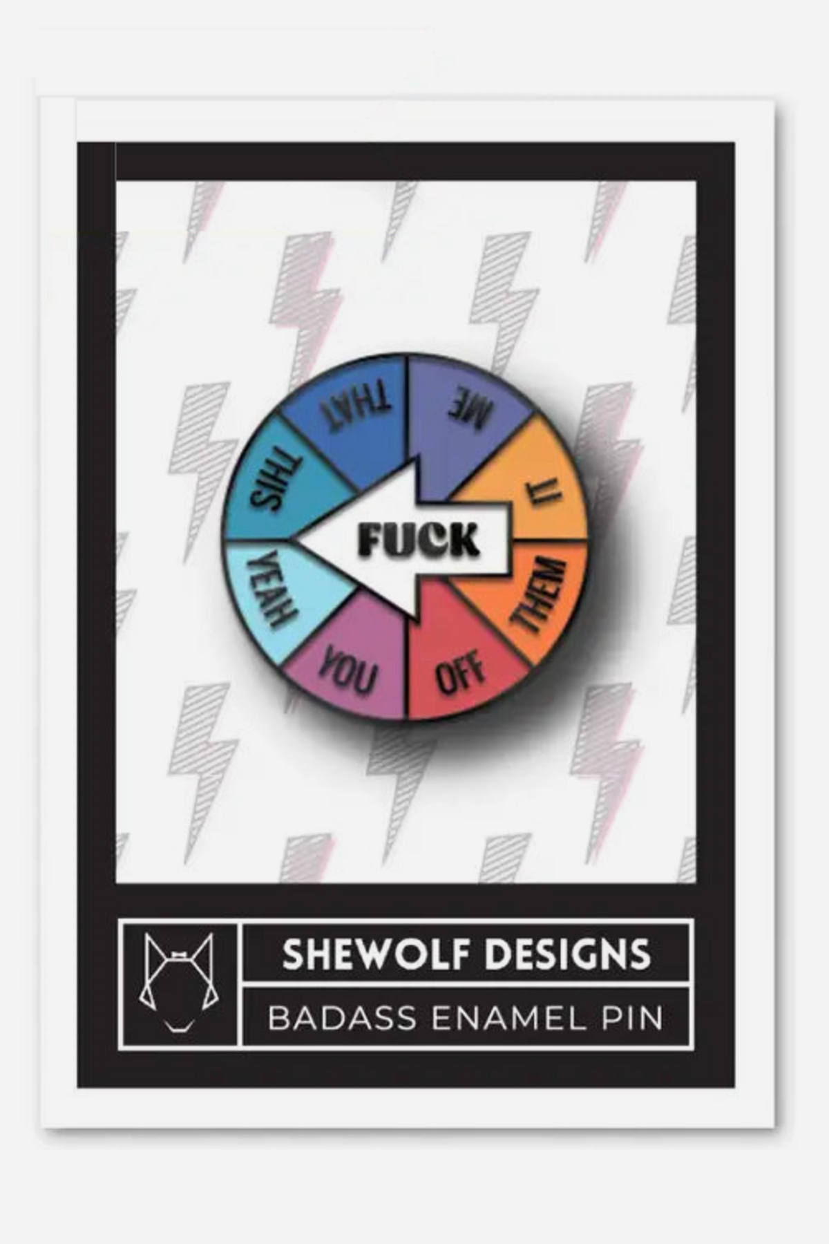 FUCK enamel spinner pin on its SHEWOLF Designs backing card, a rainbow wheel with a white arrow over a white card printed with grey lightning bolts.