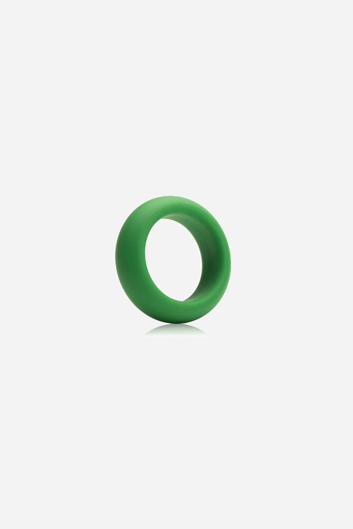 Green silicone C-ring standing at a slight tilt, showing its smooth rounded band and open centre