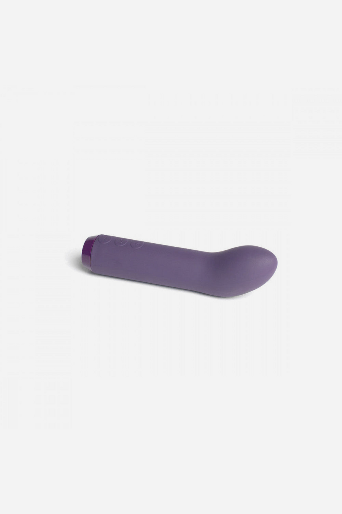 Je Joue G-spot bullet vibrator in Purple lying on its side, showing the angled tip and smooth silicone body on a light grey background