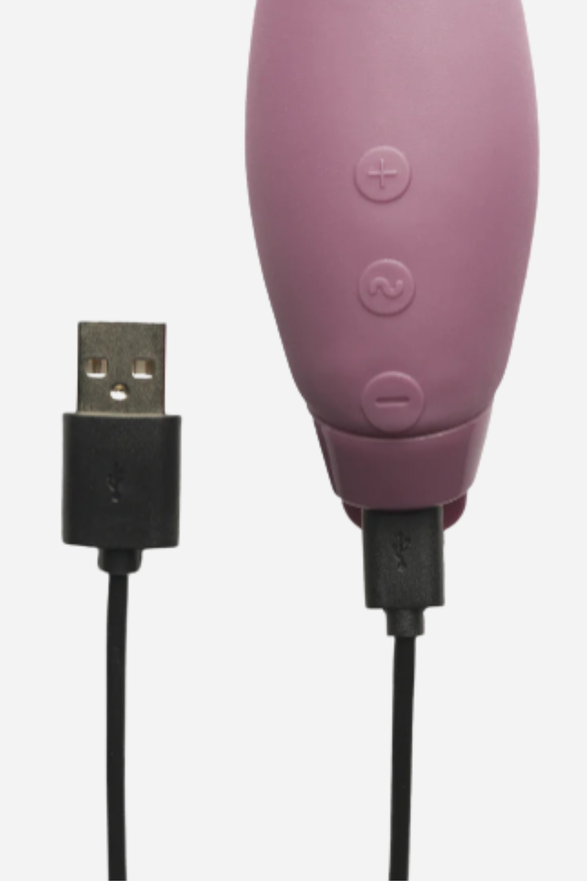 Close-up of the Je Joue Hera rabbit vibrator in Purple with its USB charging cable plugged into the base below the three buttons