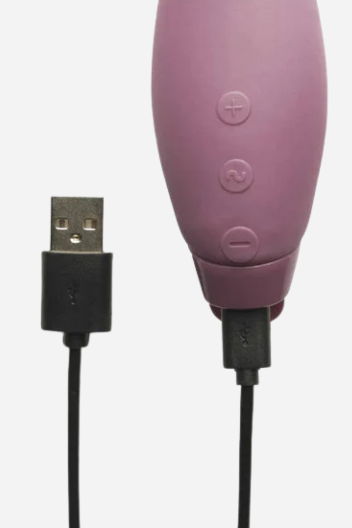 Close-up of the Je Joue Juno G-spot vibrator in Purple with its USB charging cable plugged into the base below the three buttons