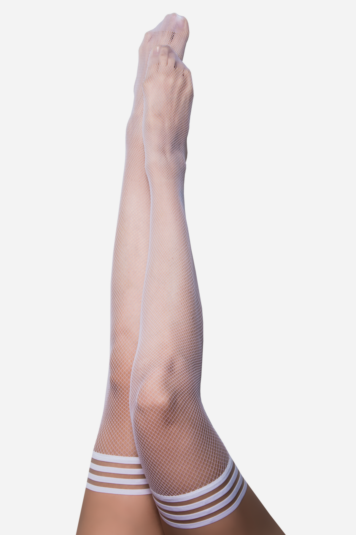 Kixies Sammy Fishnet Thigh Highs in White — legs in white fishnet stockings with a triple-stripe elastic band at the thigh