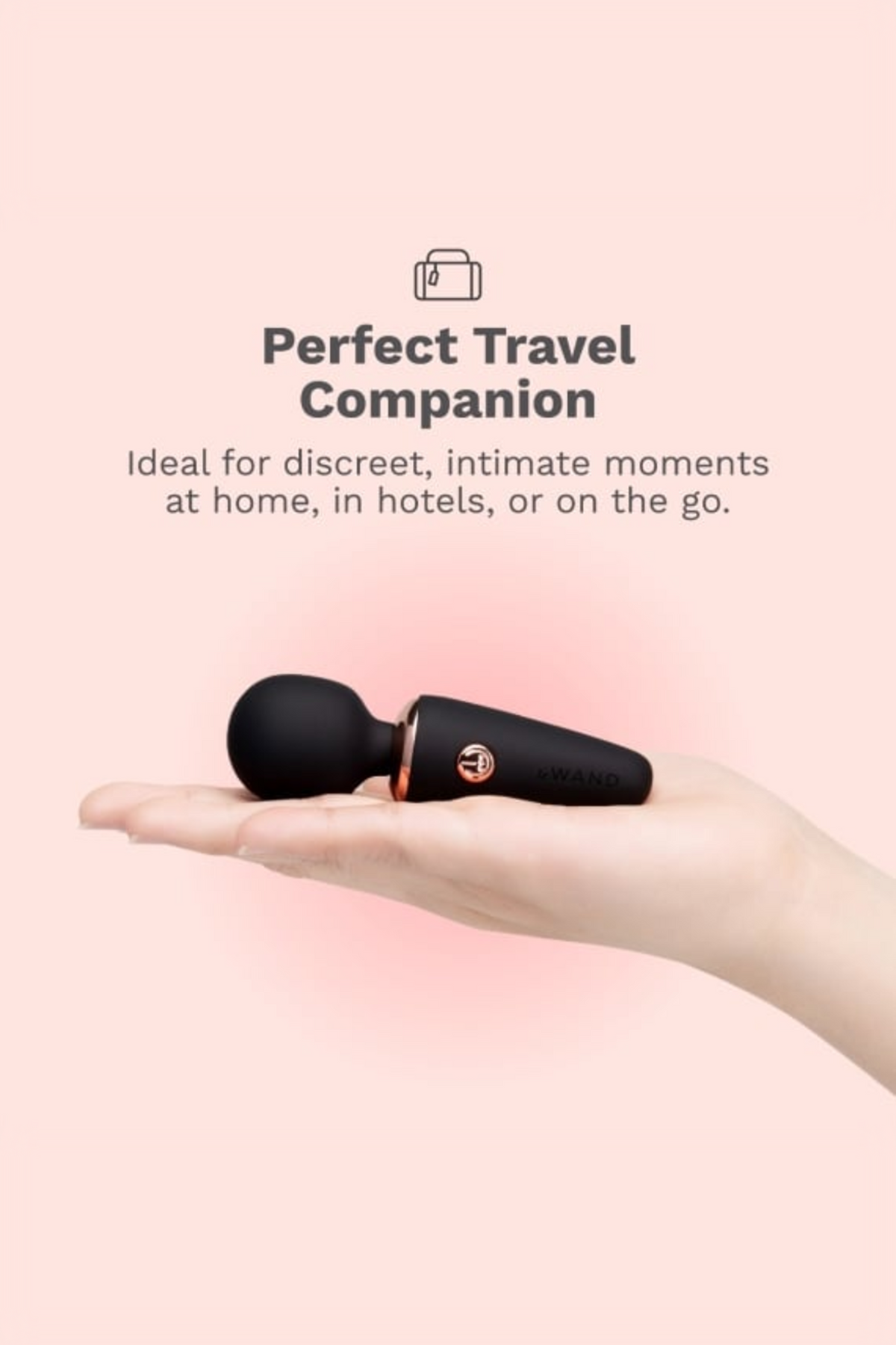 Black Le Wand Micro Wand resting on an open palm, shown as a discreet travel companion for intimate moments at home, in hotels or on the go