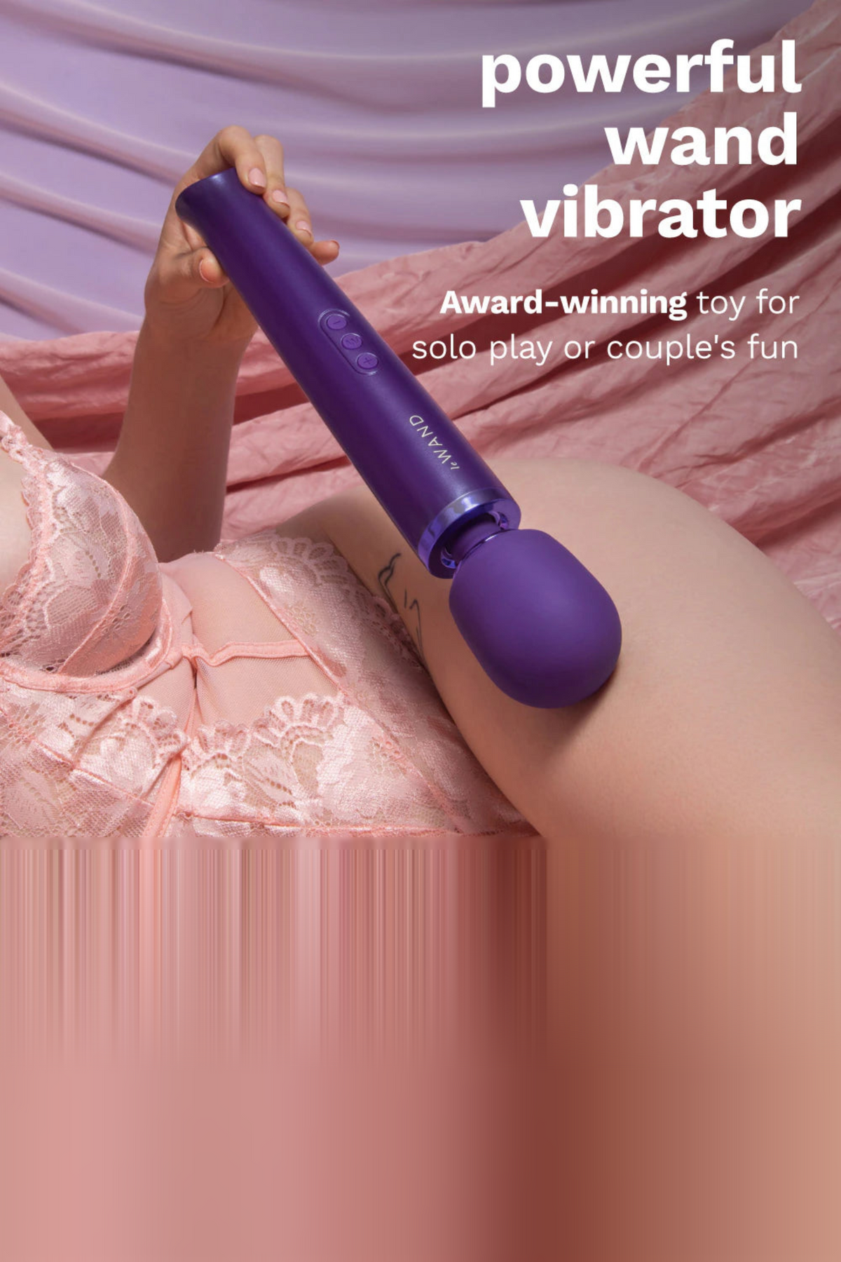 Hand holding the purple Le Wand Original Rechargeable Wand against pink lace, with text describing a powerful, award-winning wand vibrator