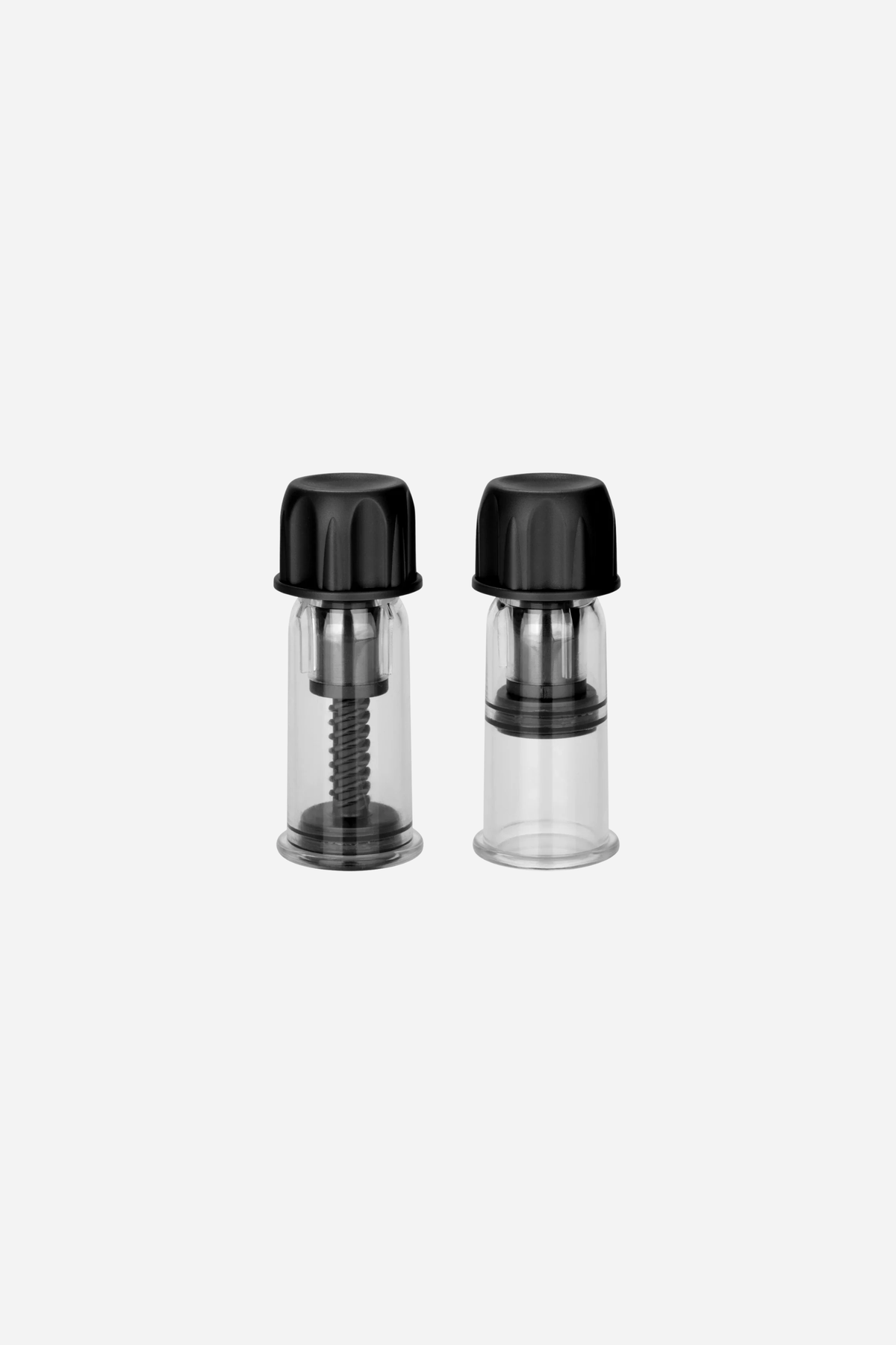 Let's Play twist nipple suckers, a pair of clear cylinders with black ribbed caps that twist to draw suction through an inner screw.