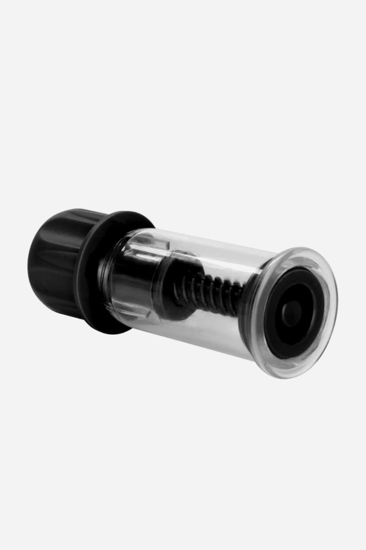 A single twist nipple sucker on its side, the clear chamber showing the black screw mechanism that runs down from the ribbed cap.