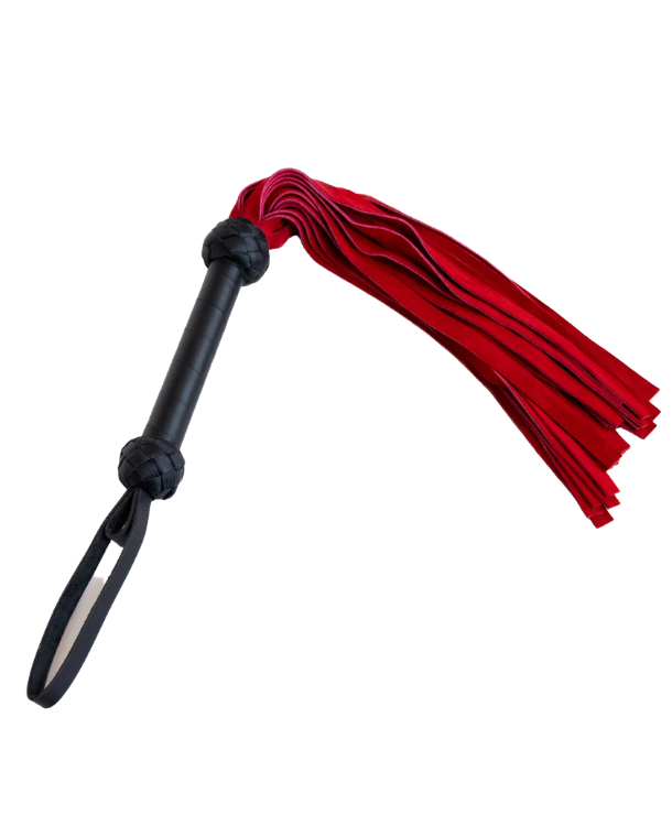 suede leather flogger with red falls. has a wrapped leather handle and a wrist loop