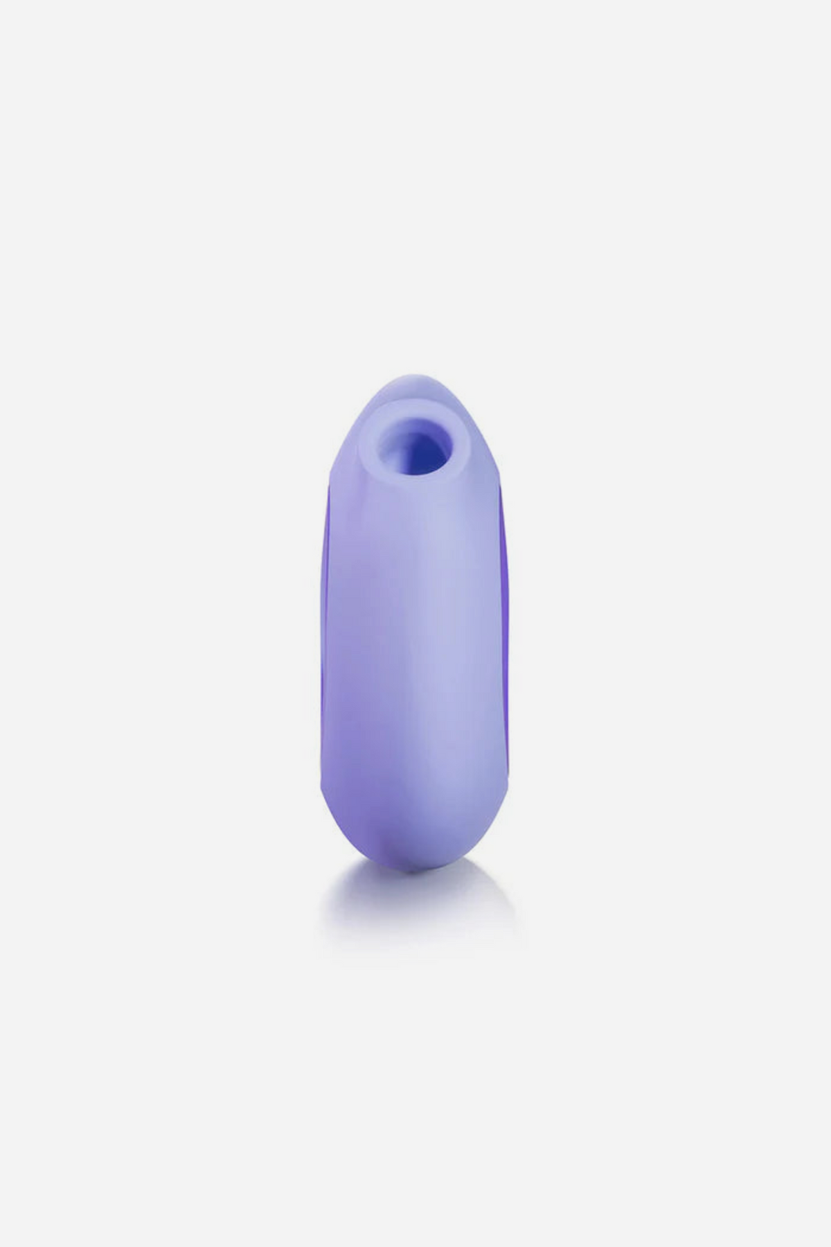 Side view of the lilac Lumii standing upright with a soft reflection, showing the air pulse opening at the top of the slim silicone body