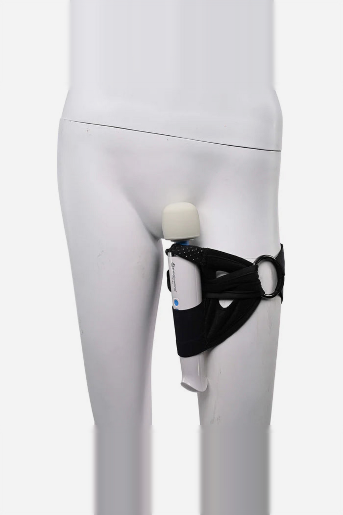 Pivot strap worn around a white mannequin's thigh, holding a wand vibrator upright against the body for hands-free forced orgasm play
