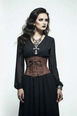 Model in a long black dress cinched with a brown lace-up waist cincher corset for a Victorian steampunk look, front view