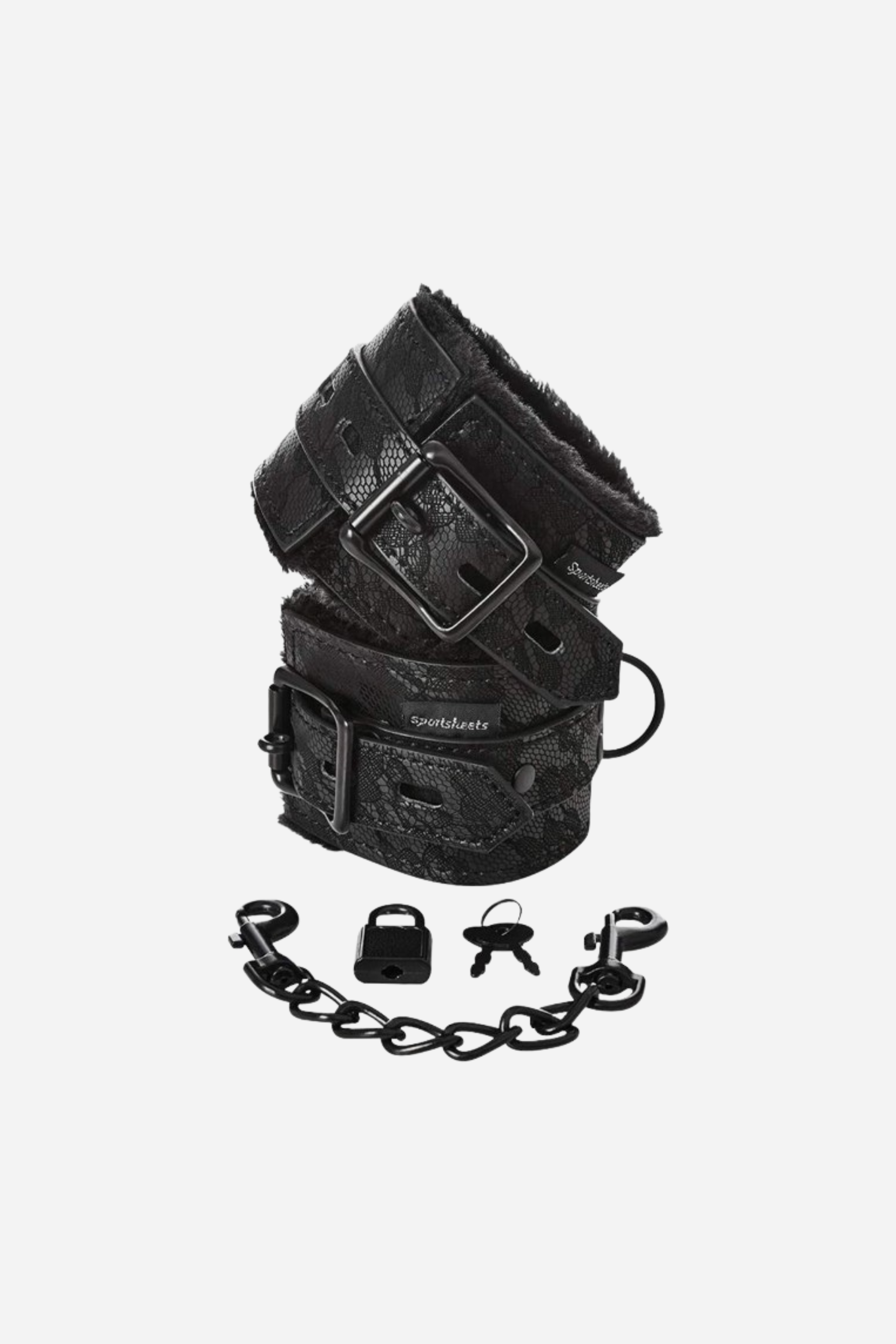 A pair of black faux leather cuffs with faux fur lining, featuring a buckle and strap for adjustment, along with two keys and a chain.