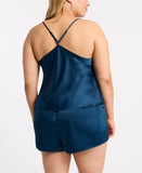 size 2x white model shows off the back of the cami set with racer back straps