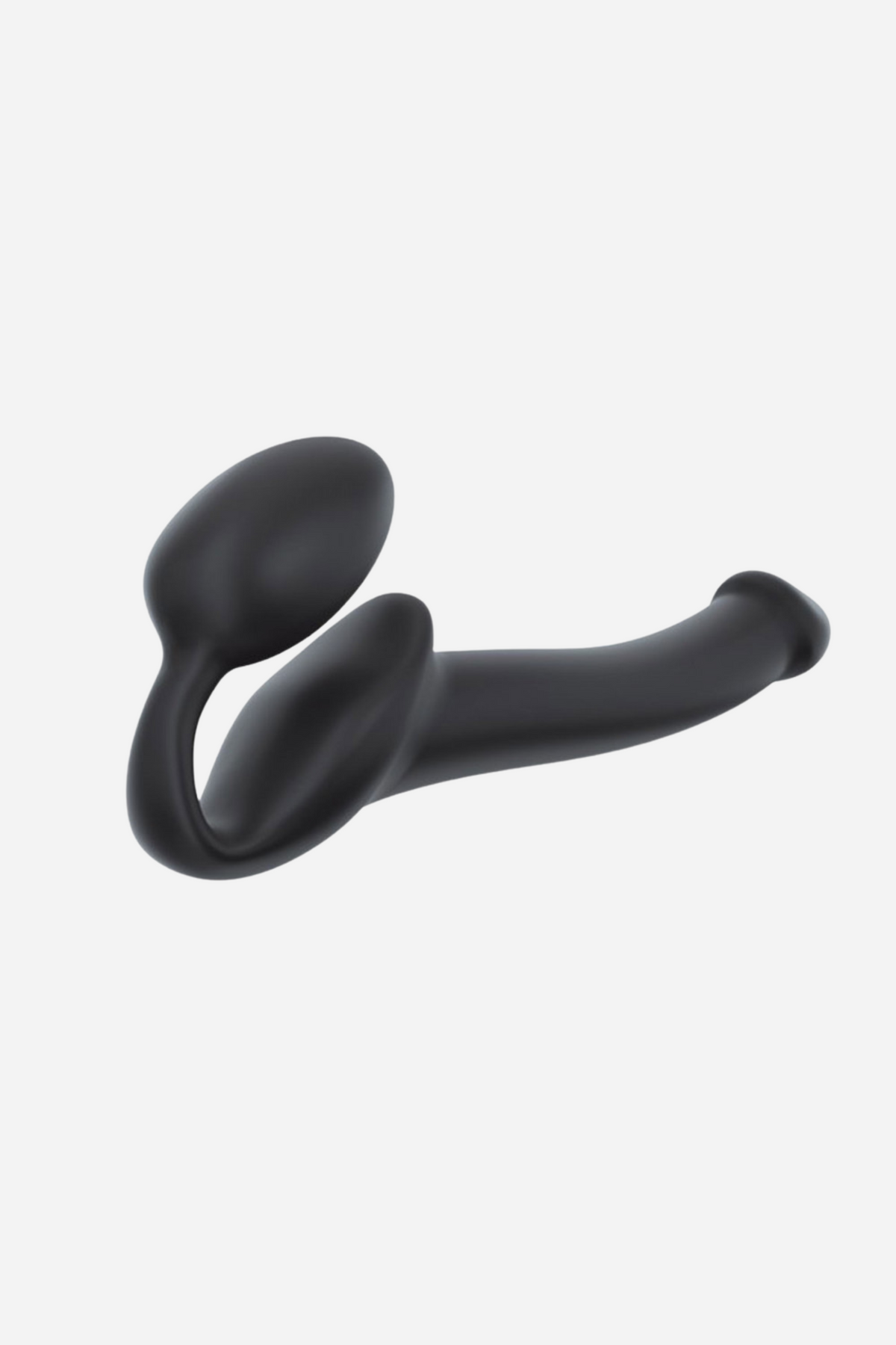 Strap-On-Me adjustable strapless dildo in black, side view of the bendable shaft and bulb-shaped internal arm on a light grey background