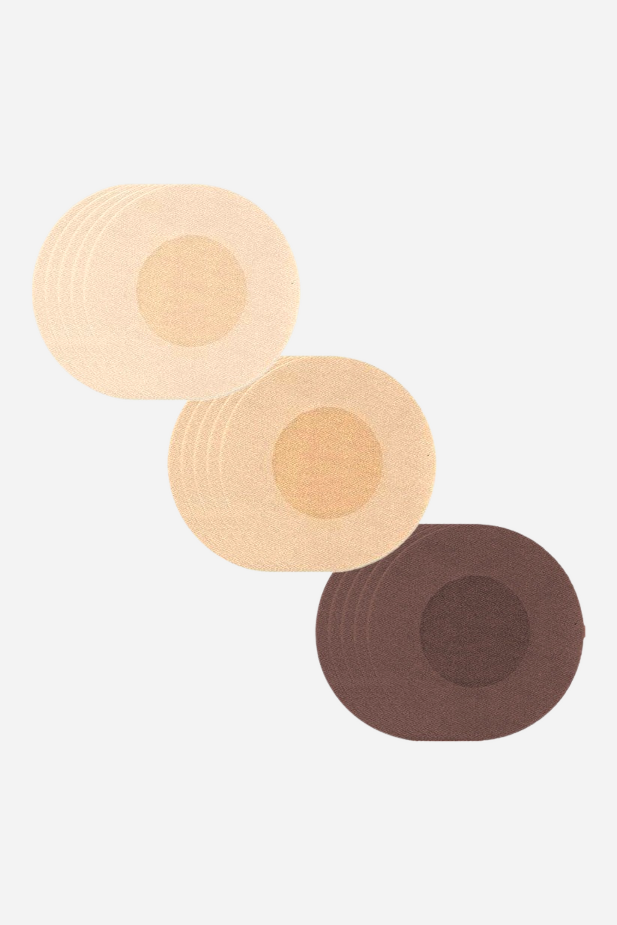 Three stacks of round non-woven fabric nipple covers by Unique in light beige, dark beige and brown, overlapping in a diagonal line