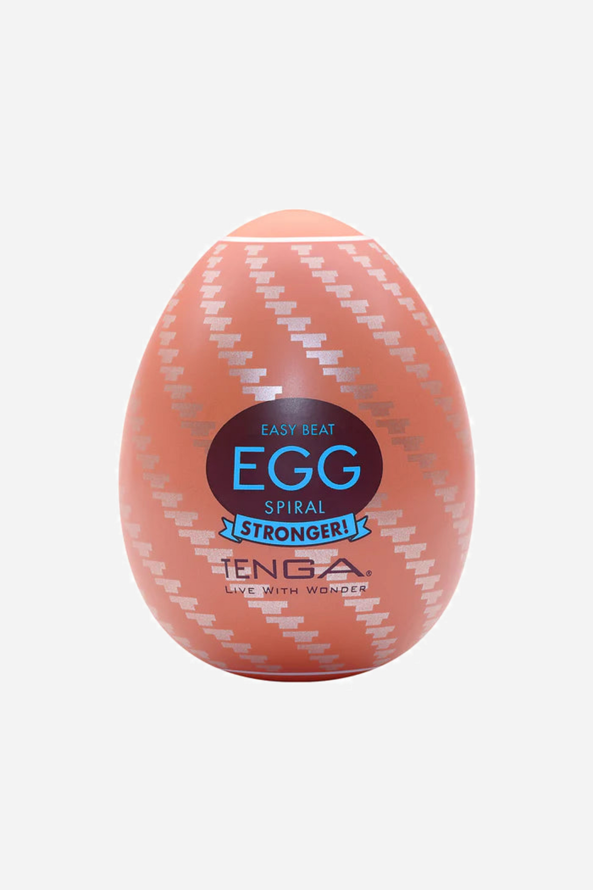 A coral pink Tenga Egg stroker with a diagonal ribbed shell and a blue and black EGG label, shown standing upright on a plain background