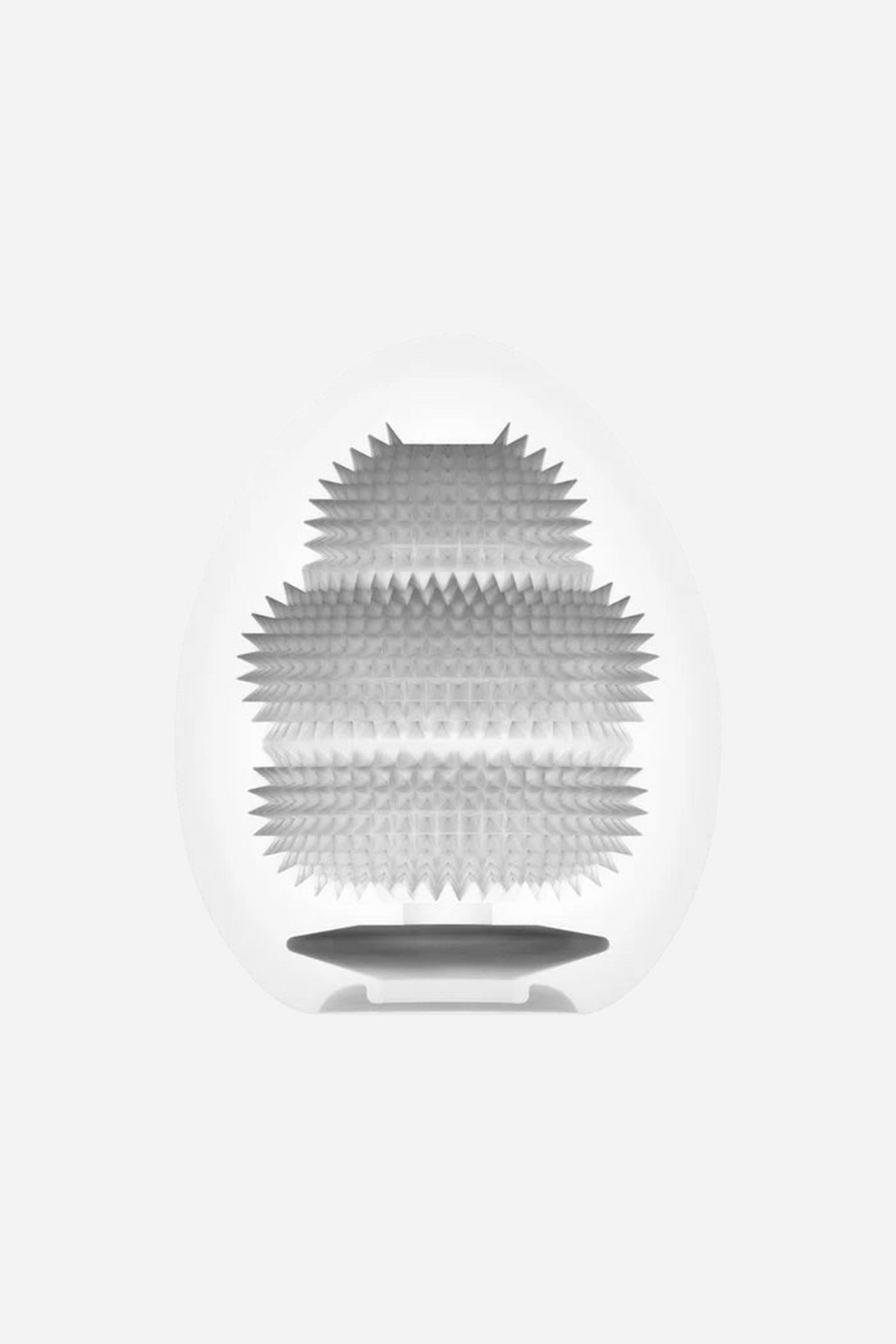 Cutaway of the Tenga Egg Misty sleeve, showing the closely spaced horizontal ribs running down the soft white interior of the stroker
