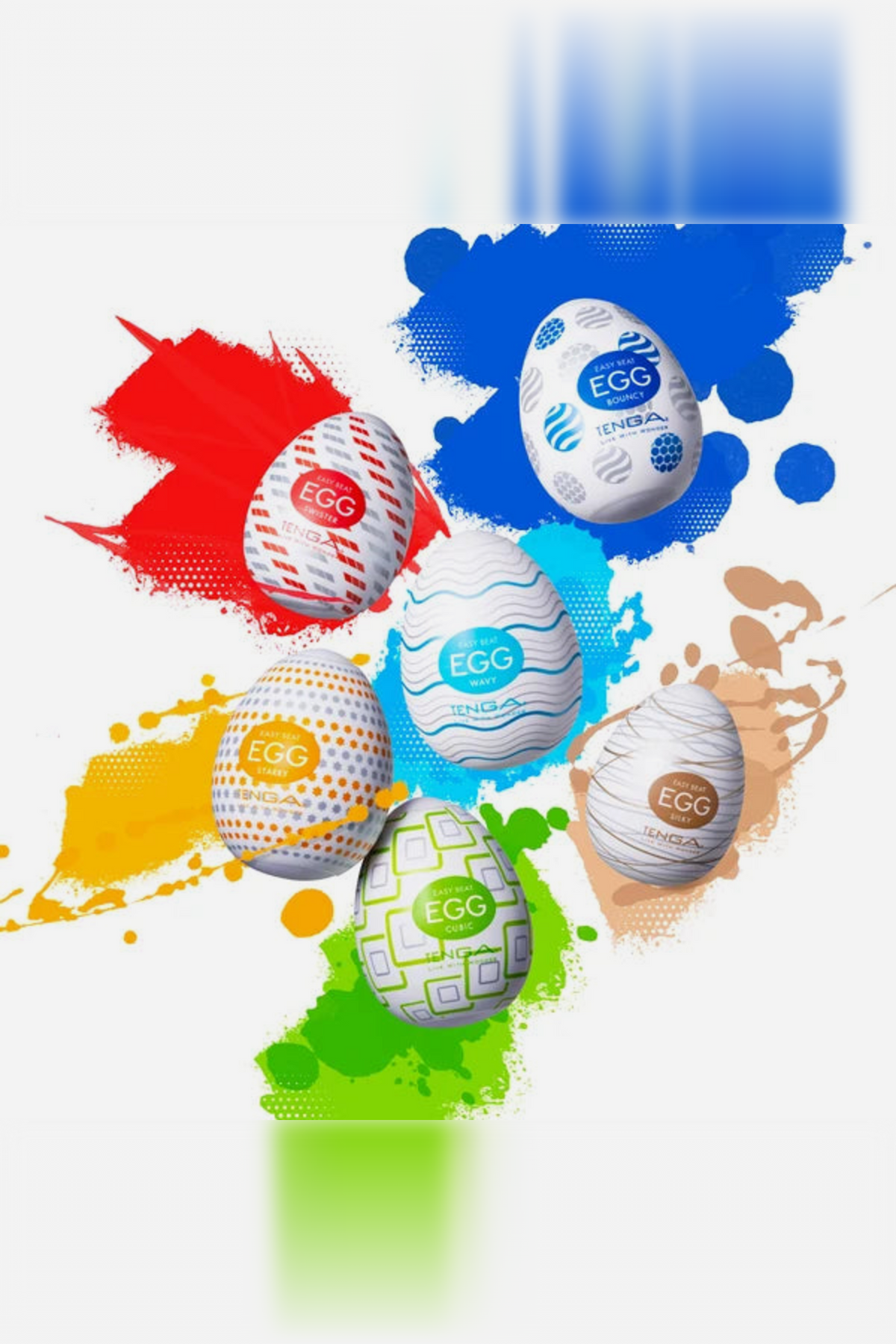 Six Tenga Egg Standard Strokers in bright colours bursting out of a paint splash, showing the full range of patterns to choose from