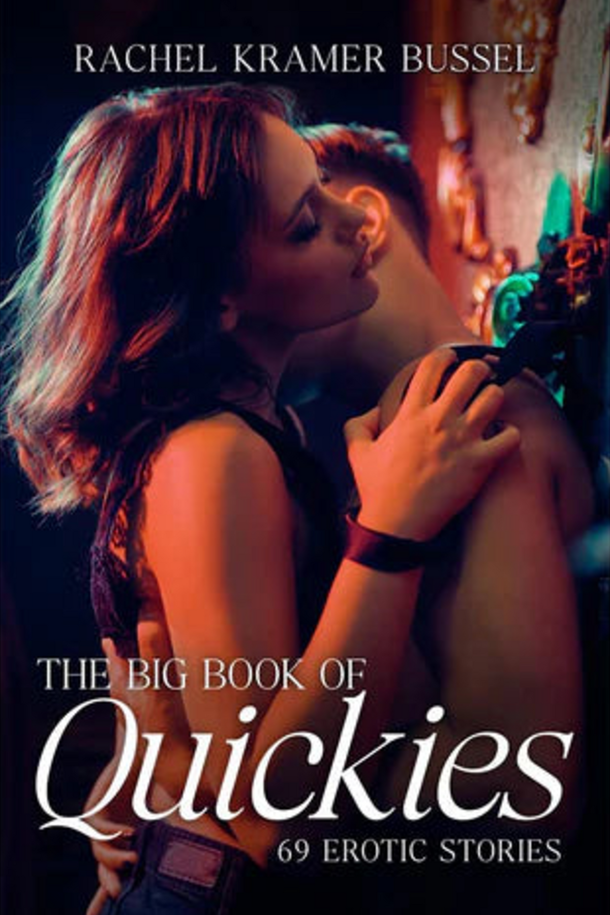 Book cover of The Big Book of Quickies: 69 Erotic Stories by Rachel Kramer Bussel, showing a couple in a close embrace in warm, moody red lighting.