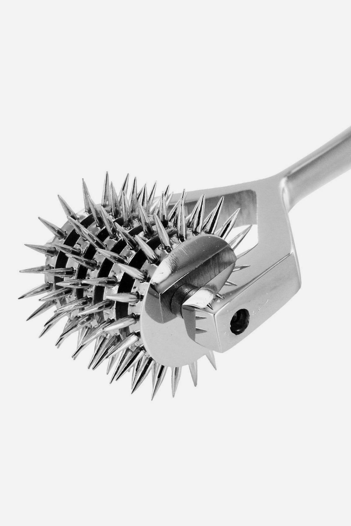 Close-up of the five-row Wartenberg sensation pinwheel showing the needle-sharp steel spikes, the axle bolt through the fork and the polished metal handle.