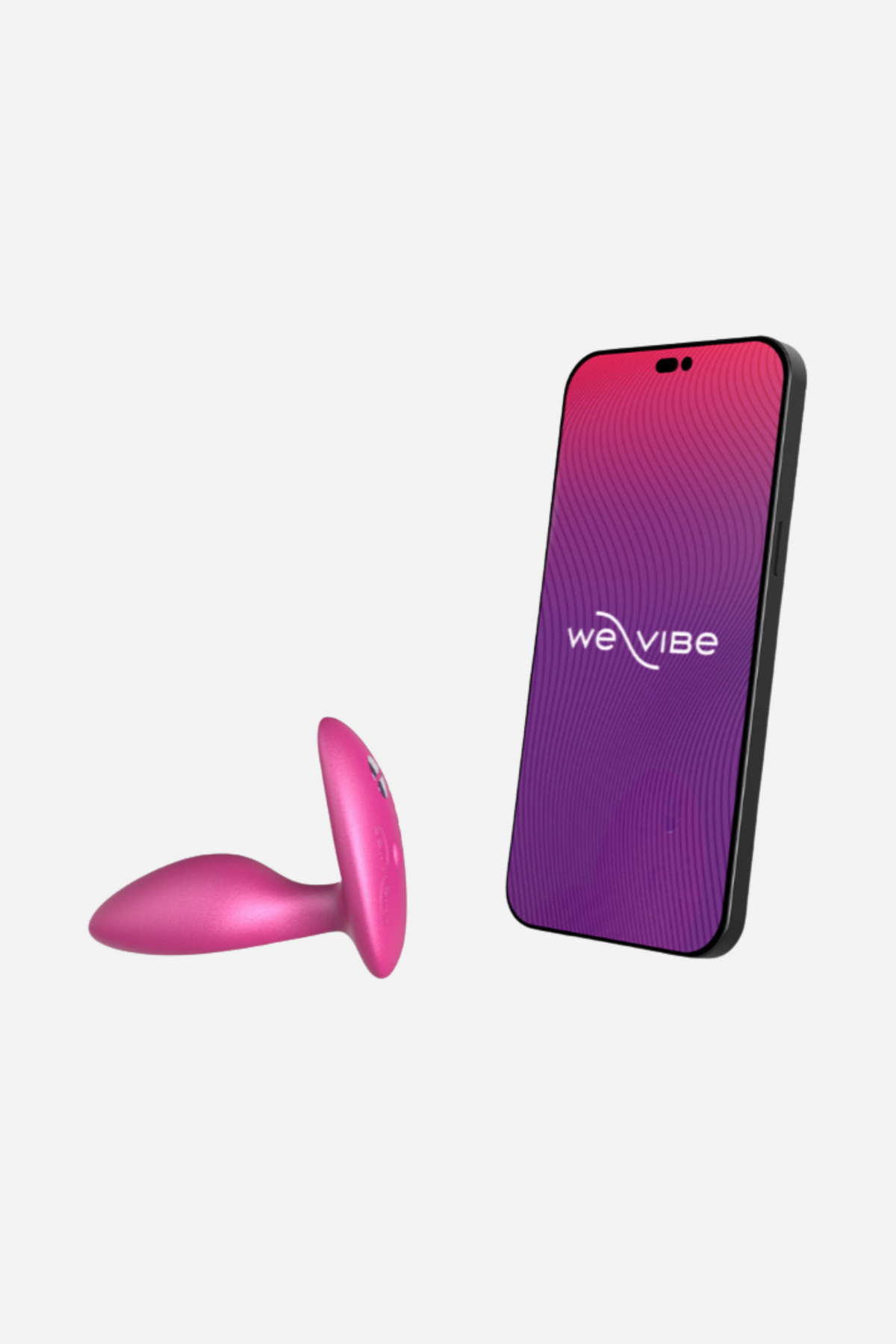 Pink We-Vibe Ditto+ plug next to a smartphone showing the We-Vibe app, used for app control, long-distance play and custom vibrations