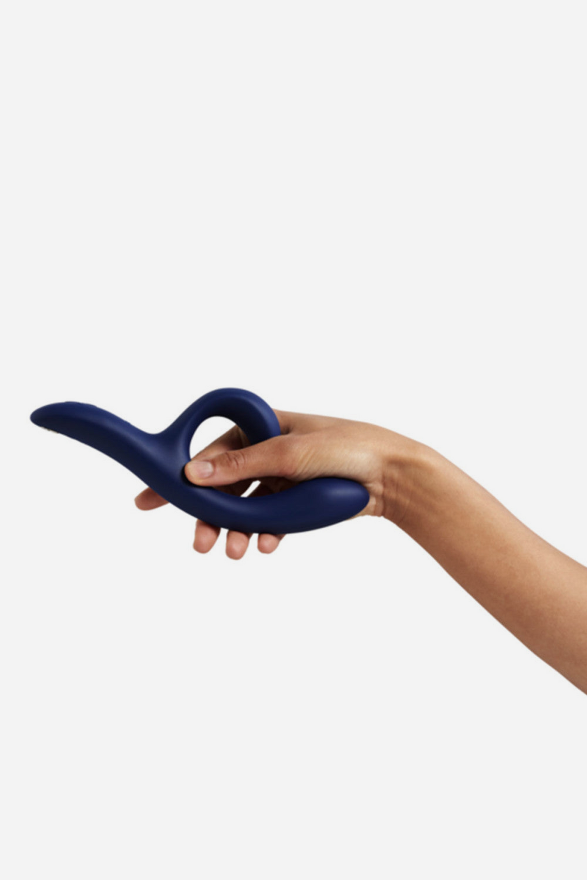 Hand holding the midnight blue We-Vibe Nova 2 Rabbit Vibe at arm's length, showing its full length and the ergonomic curved handle