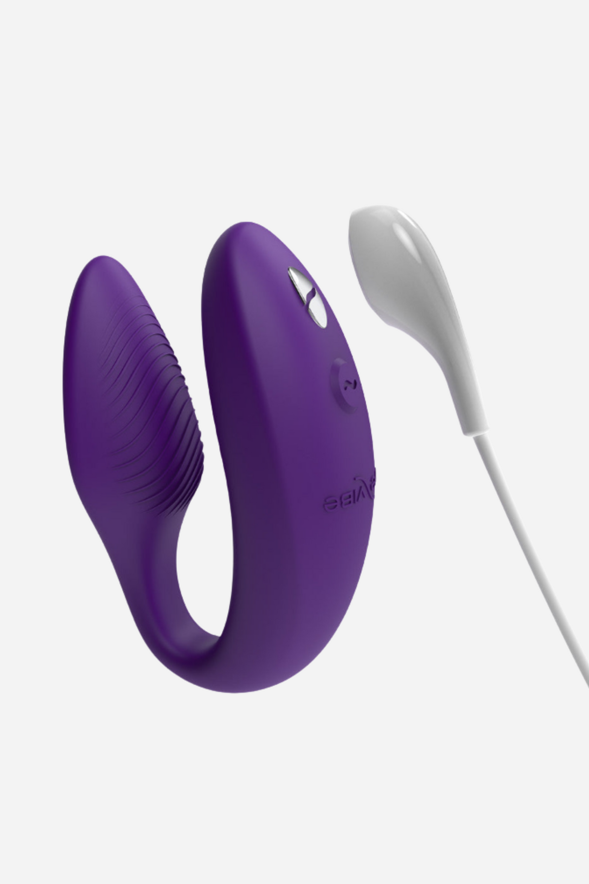 Purple We-Vibe Sync 2 standing upright beside its white magnetic charging cable, showing the flexible C-shaped silicone body