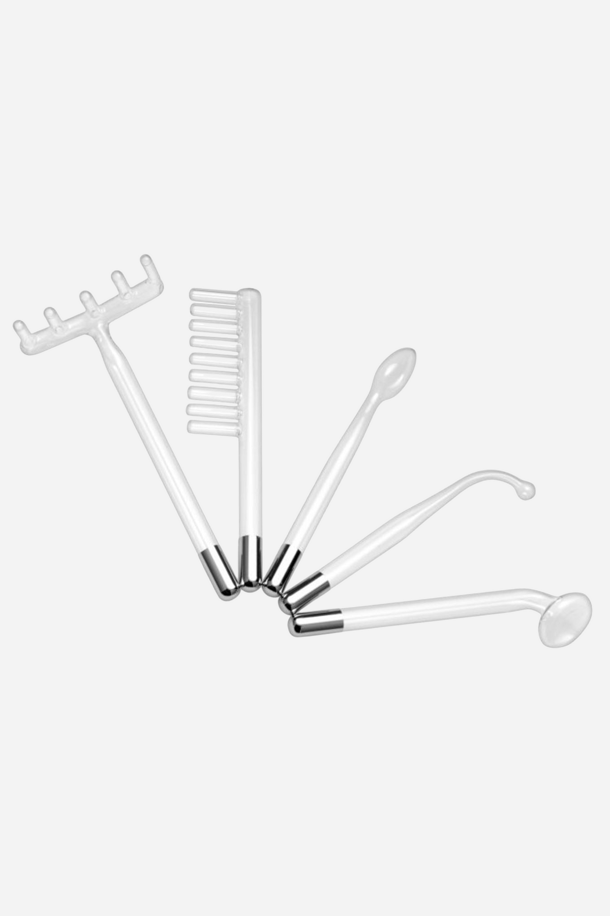 Five clear glass violet wand attachments fanned out side by side: a pronged rake, a flat comb, a rounded probe, a curved hook and a spoon.