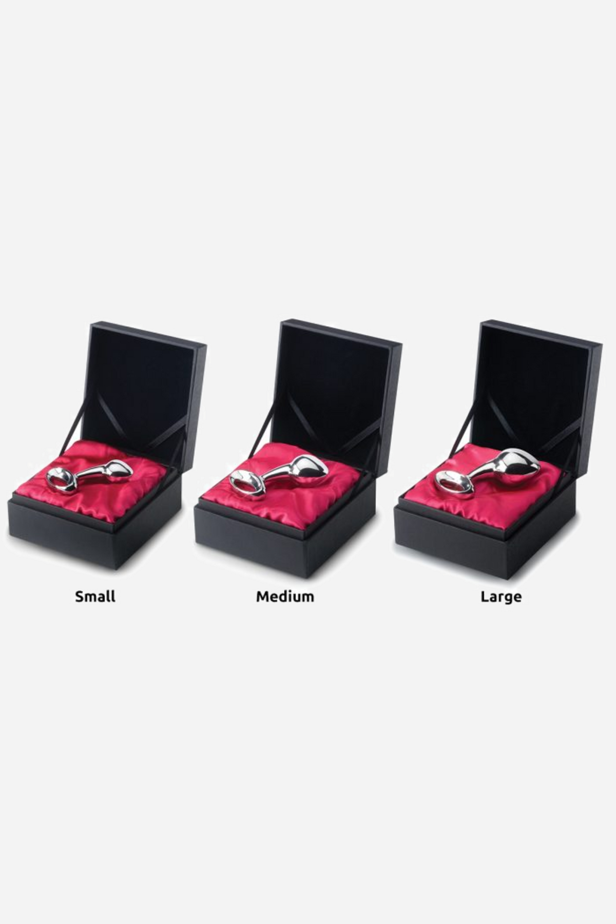 The njoy Pure Plug in small, medium and large, each shown in its own black box on pink satin