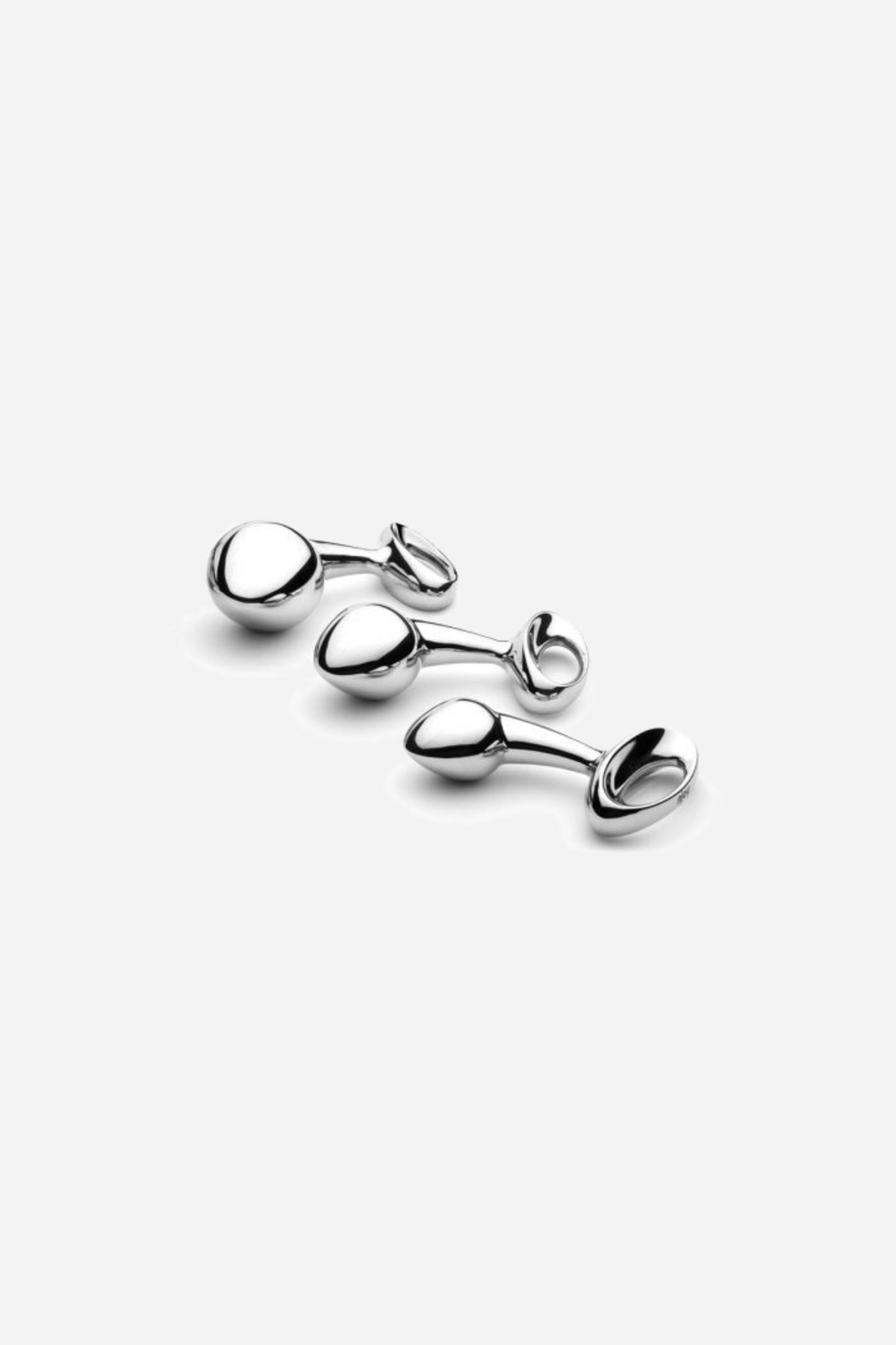 The three njoy Pure Plug sizes side by side, polished stainless steel with looped handles