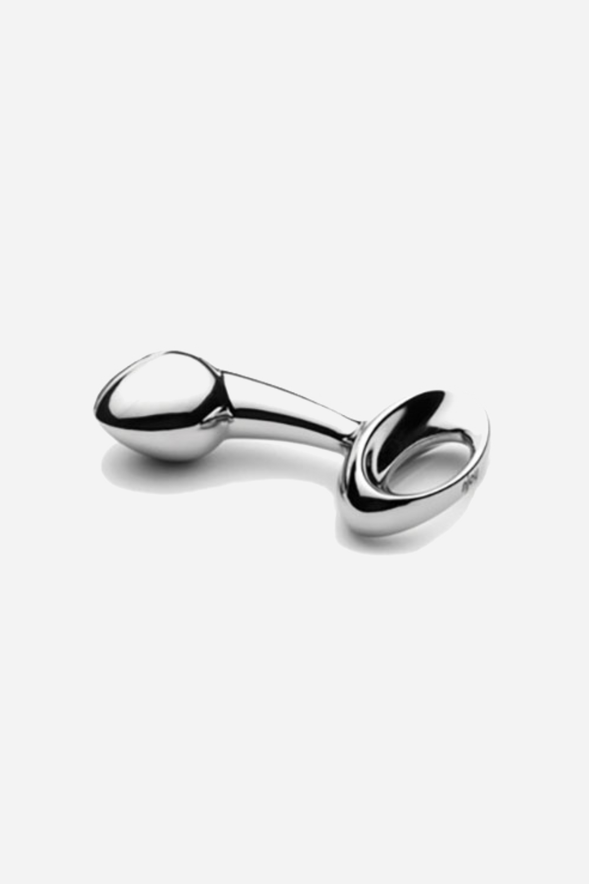 The small njoy Pure Plug shown on its own, showing the mirror polished steel, the tapered tip and the wide looped base it sits on