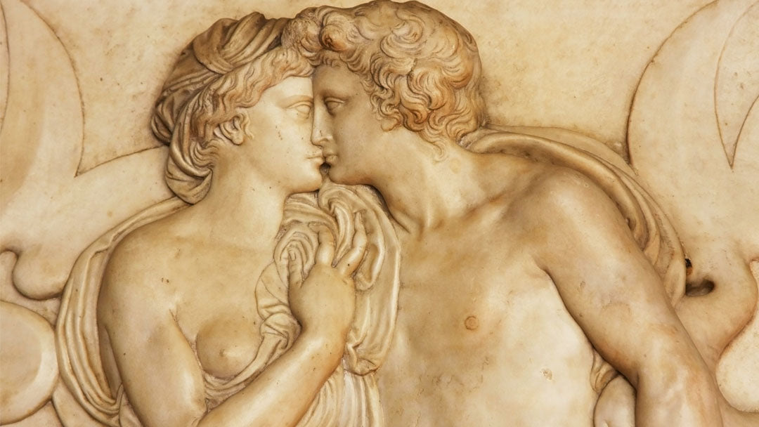 Renaissance fresco of a man and woman partially undressed and kissing