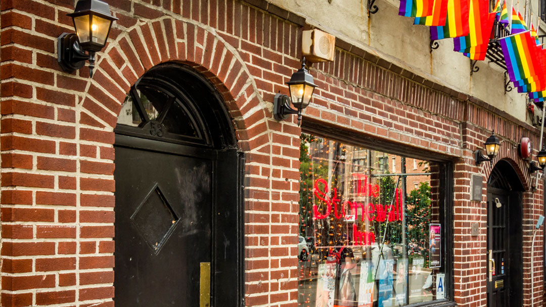 Image of Stonewall Inn exterior with Pride rainbow flags