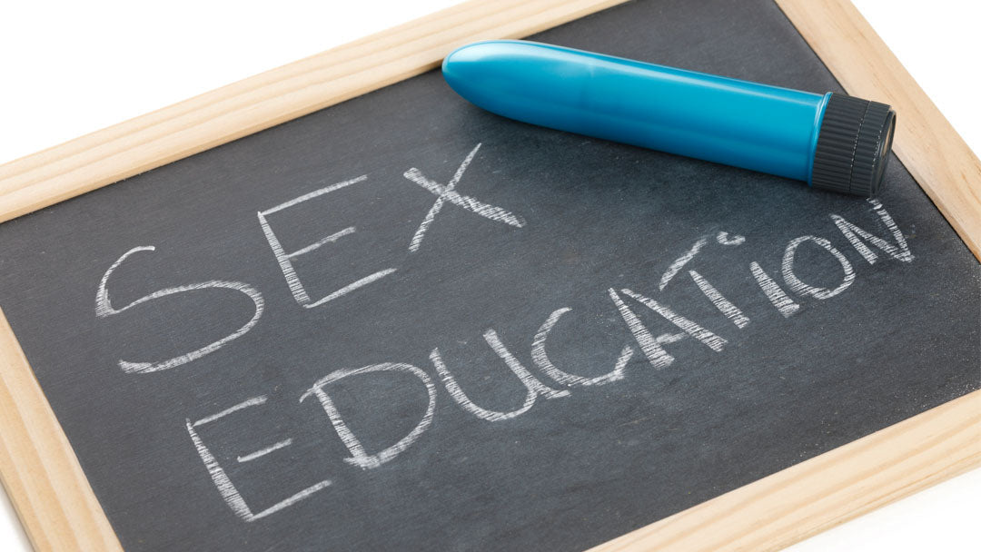 Chalkboard that says Sex Education with vibrator on top of it