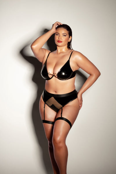 plus sized model poses seductively with hand in her hair and hip popped. she is wearing the Femme Fatale Bralette and Panty Set