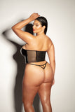 sexy plus size model shows off the back of her fetish corset with mesh sides and g-string