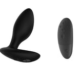 black vibrating butt plug and a black remote. meant to show that the anal plug can be controlled with the remote